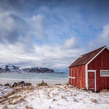 Red hut at Ramberg beach, Lofoten, Norway