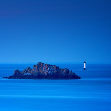 Last light on lighthouse, France