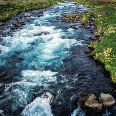 Colorful river near Strokkur, Iceland