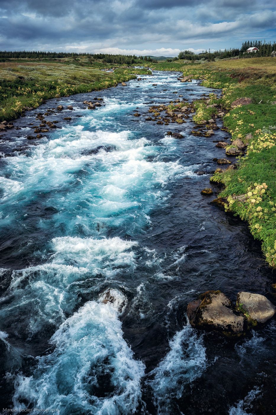 Colorful river near Strokkur, Iceland