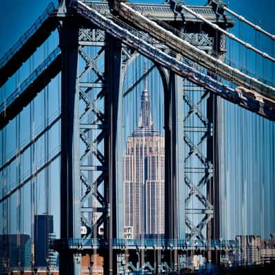 Empire State Building view through Manhattan Bridge, USA