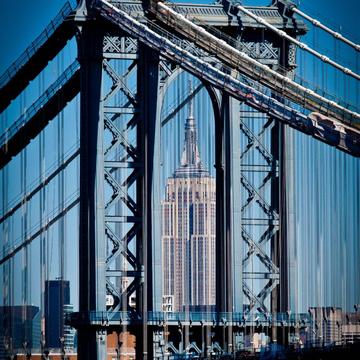 Empire State Building view through Manhattan Bridge, USA