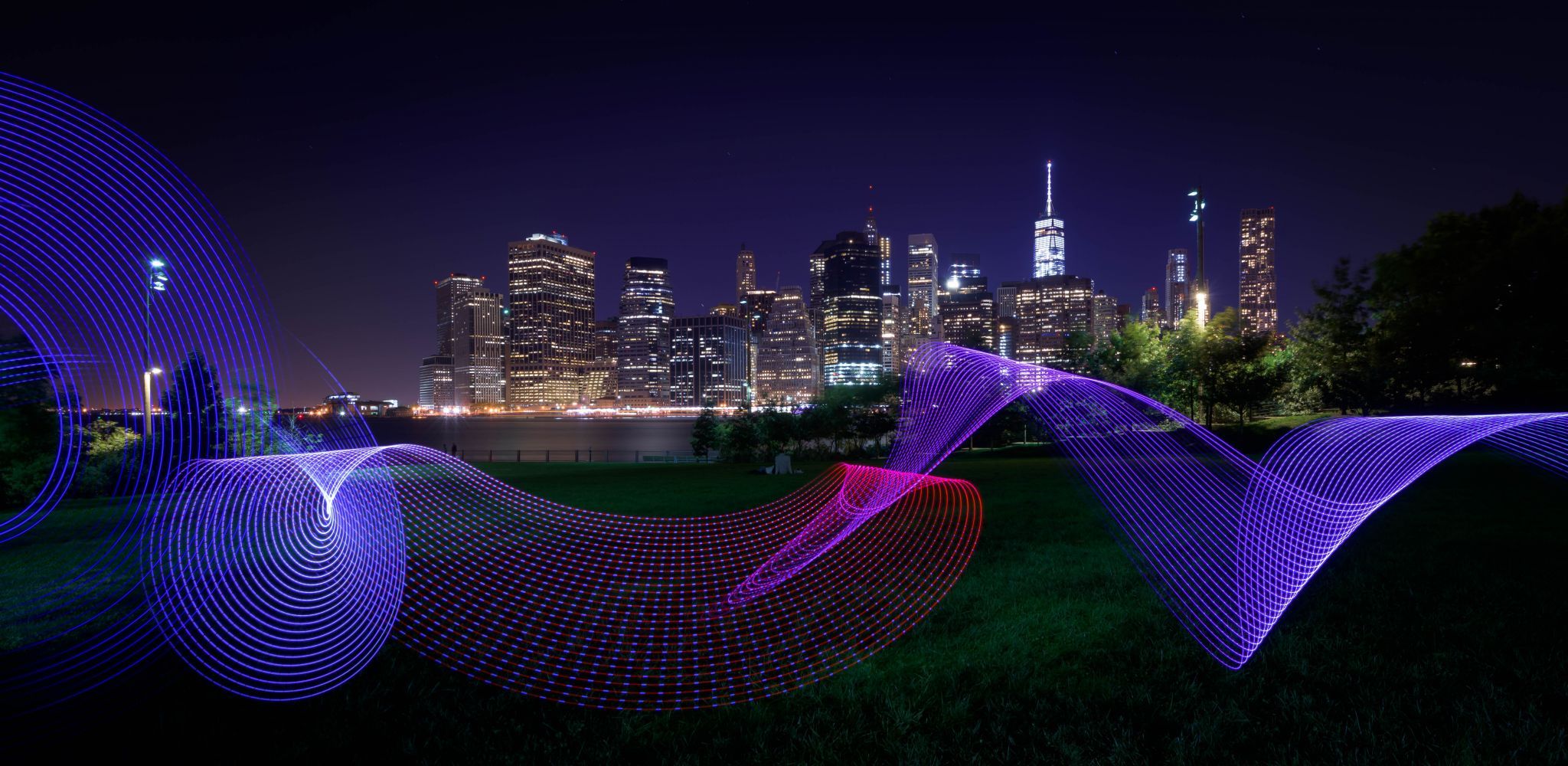New York Lightpainting Skyline with river and Meadow, USA