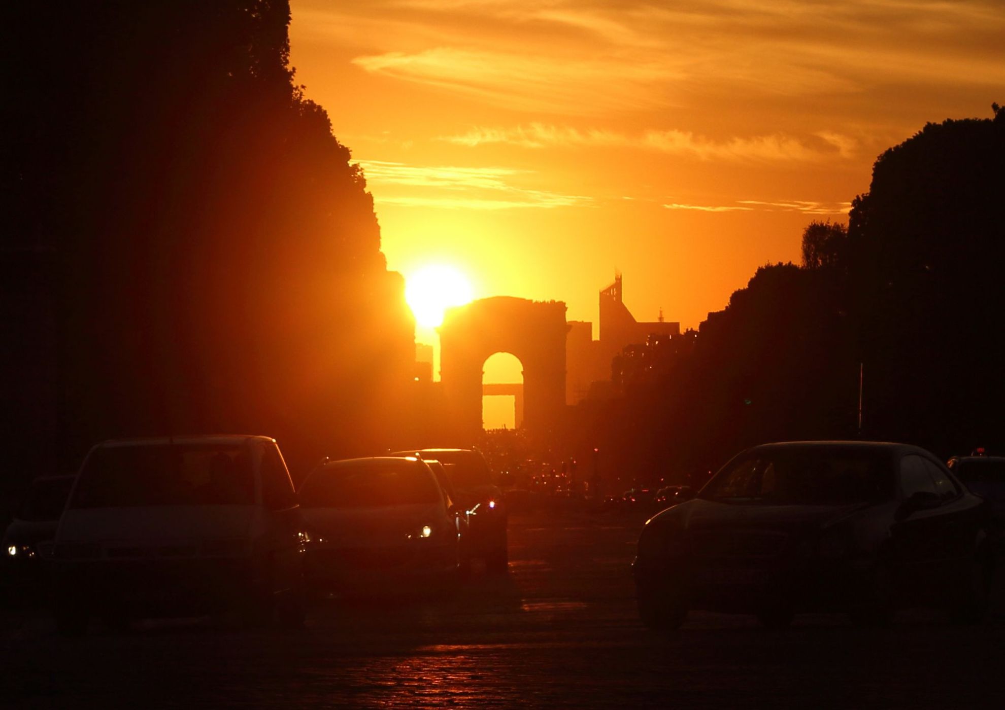 Sunset behind Arc de Triomphe, France