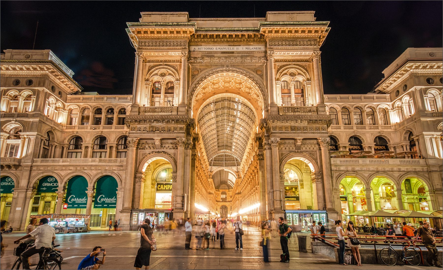 Arch at the entrance to the Galleria Vittorio Emanuele II at night