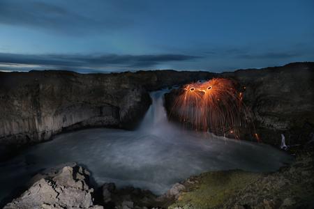 Traveler near Aldeyjarfoss Waterfall in Iceland