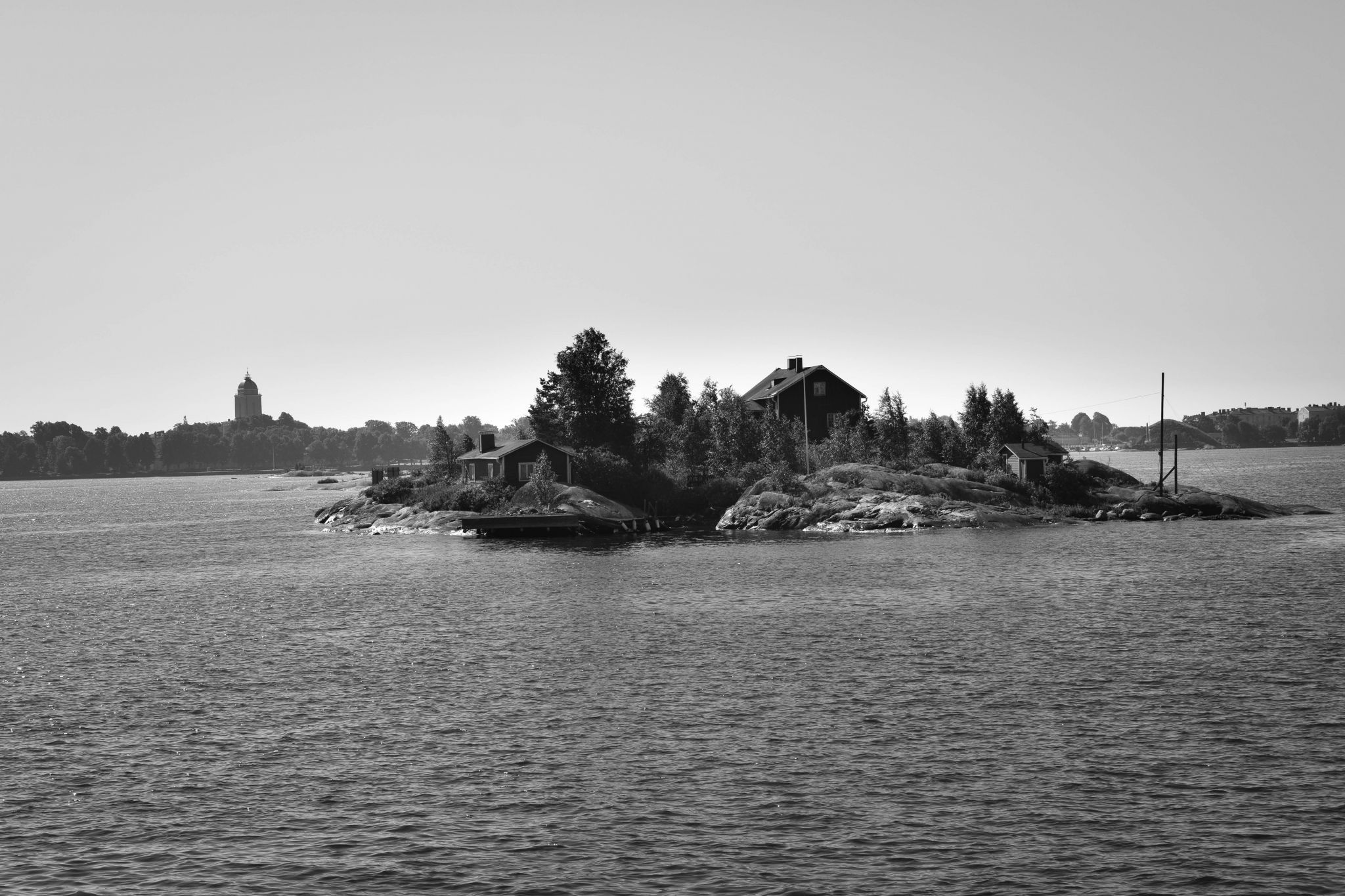 Wood house on small island, bay of Helsinki, Finland