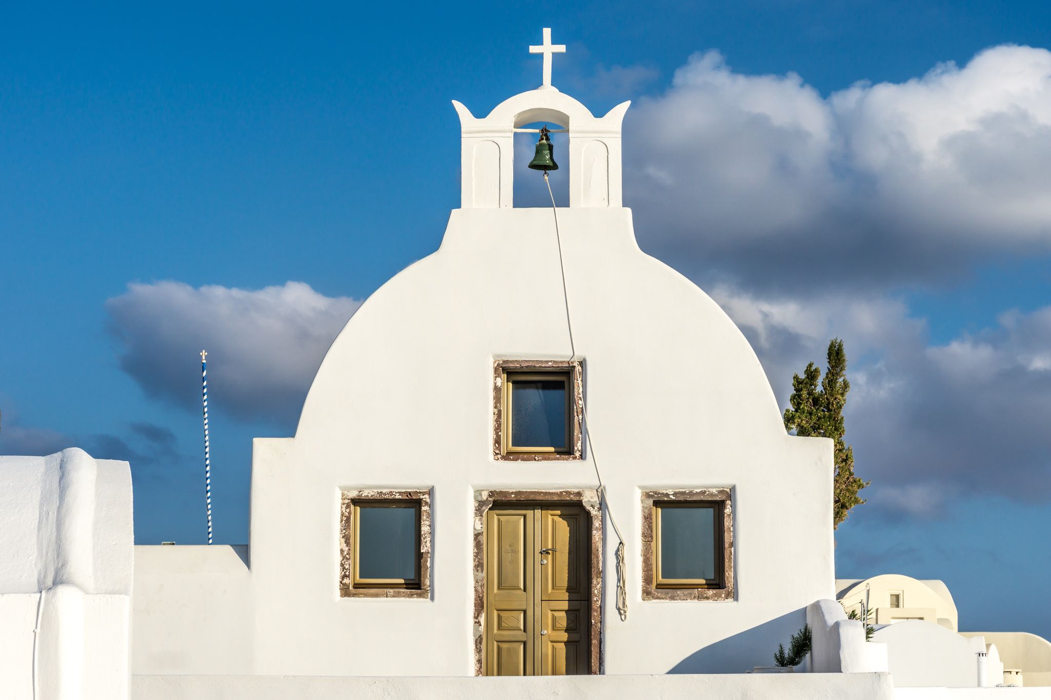 Withe chapel in IO Santorini, Greece