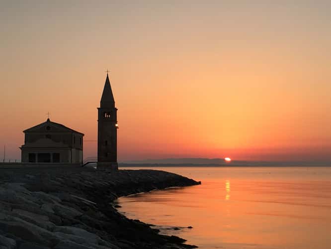 Caorle Lighthouse and Ciesa Madonna dell'Angelo