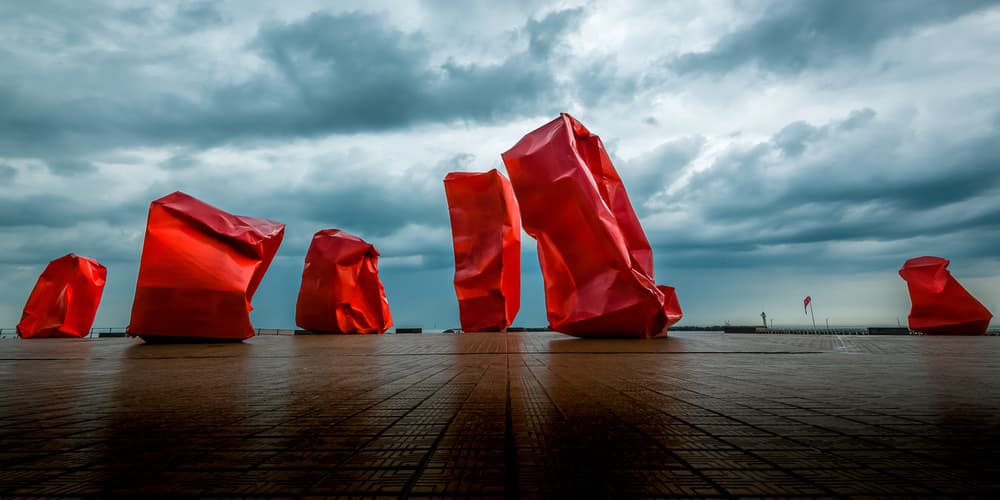 Red 'Rock Strangers' Sculpture at harbour's mouth in Ostend