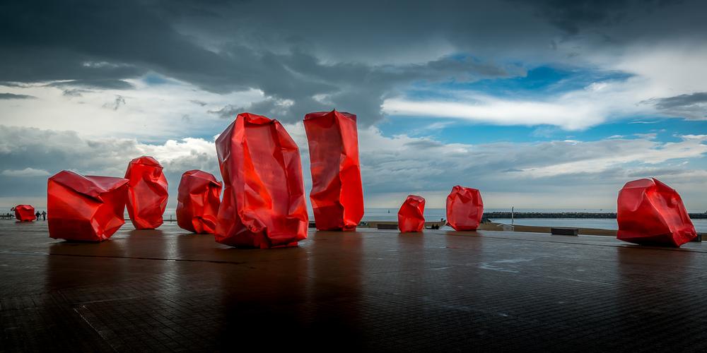 Red 'Rock Strangers' Sculpture at harbour's mouth in Ostend