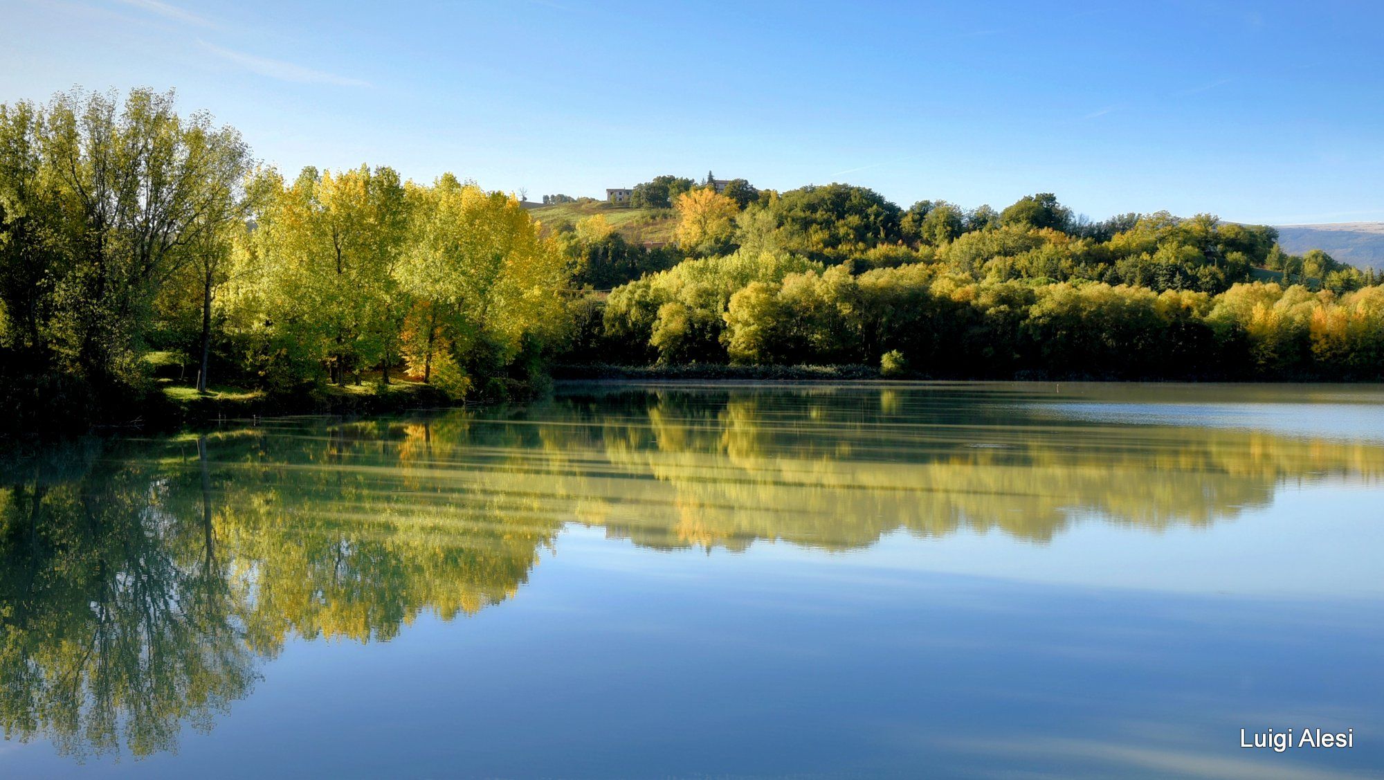 Reflections at le Grazie lake, Italy