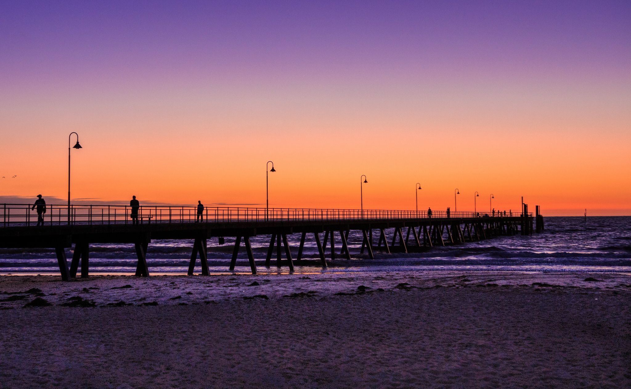 Glenelg Pier with frothy water Adelaide, Australia