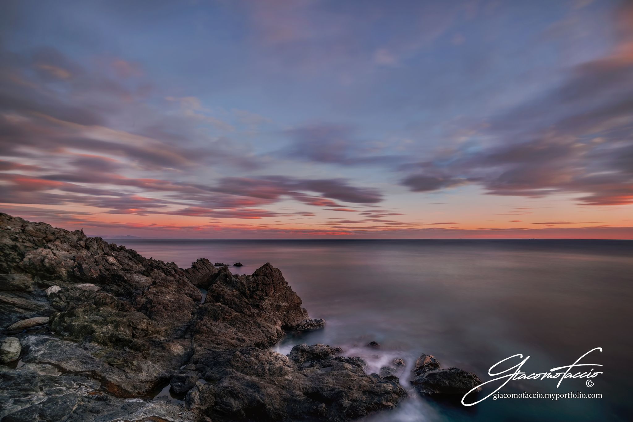 Black rocks sunset, Italy