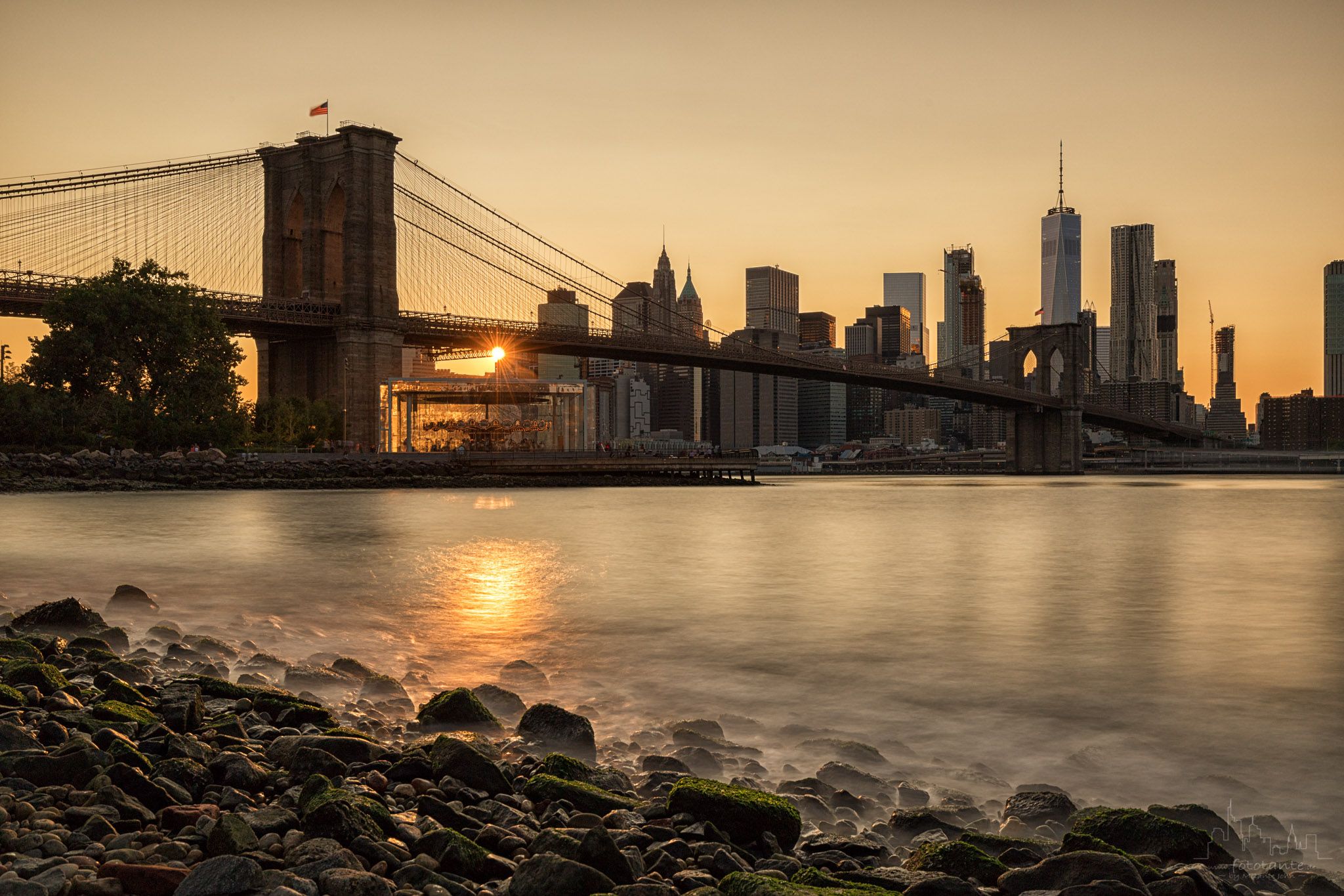 Brooklyn Bridge skyline from Pebble Beach, New York City, USA