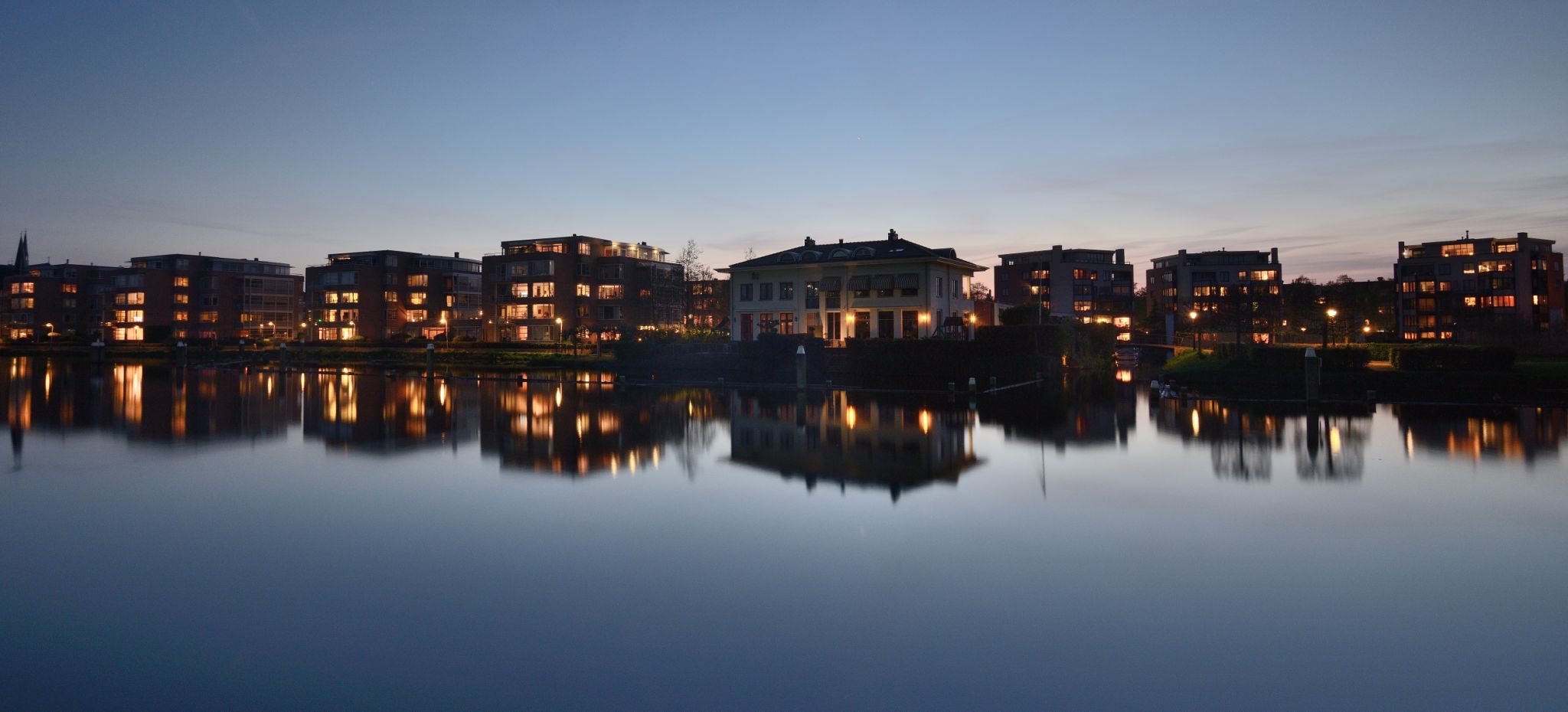 Reflection of houses on the Vliet river, Netherlands