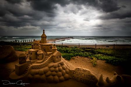 Stormy Durban beach with sand Castle