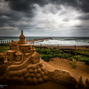 Stormy Durban beach with sand Castle, South Africa