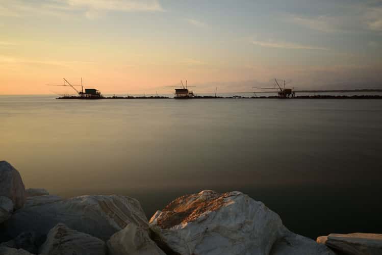 Fishermen's huts on Marina di Pisa at sunset