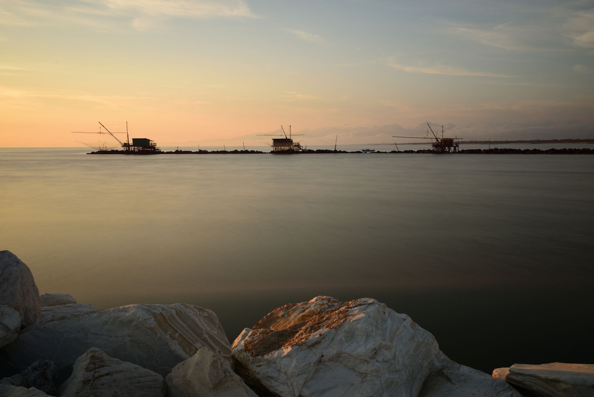 Fishermen's huts on Marina di Pisa at sunset, Italy