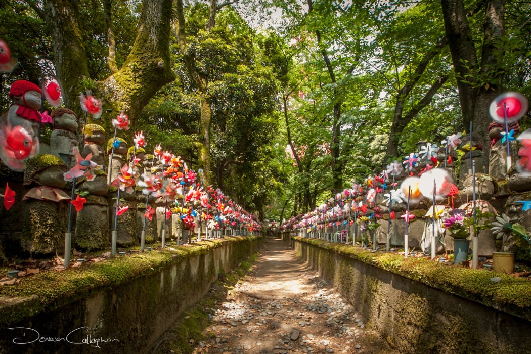 Line of child statues Zojo-ji Temple Cemetery Tokyo, Japan