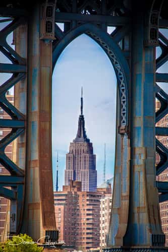 Empire State Building framed by Manhattan Bridge, New York City