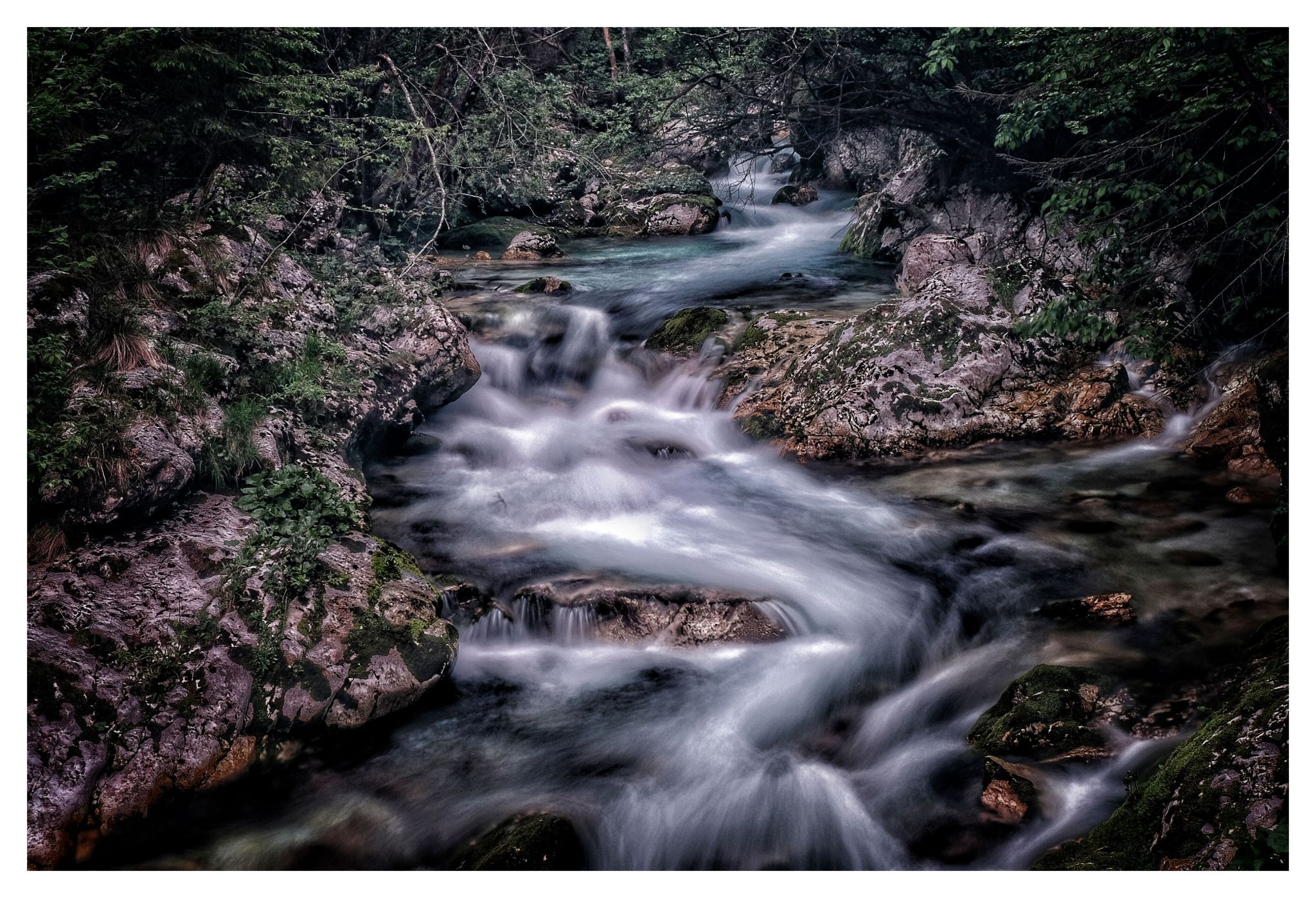 Watercourse with waterfalls and bridges near Bovec, Slovenia