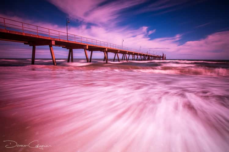Glenelg Pier with frothy water Adelaide