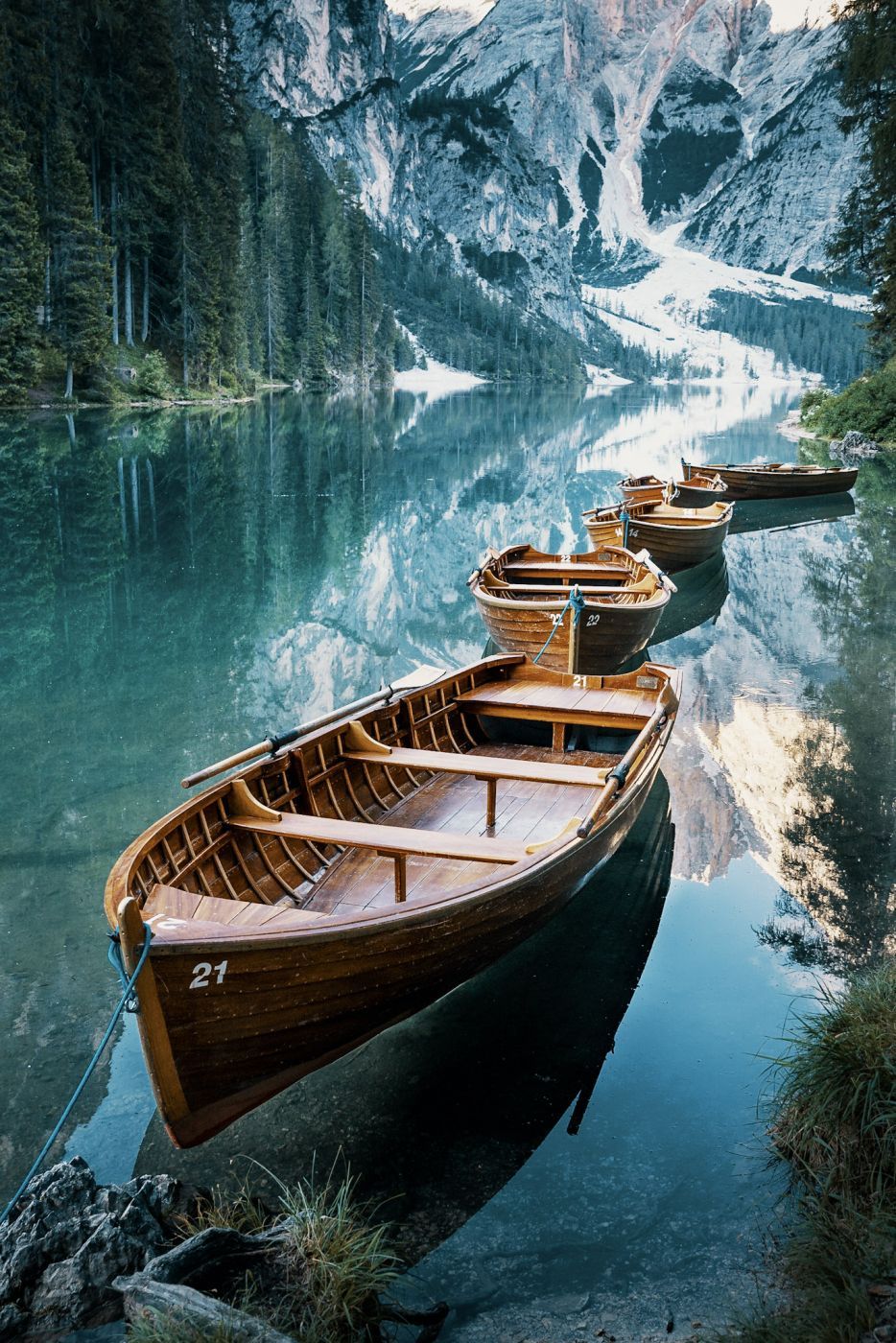 Boats in a bay of the Braies Lake, Dolomites, Italy