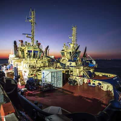 Two tug boats on Stokes Hill wharf sunrise Darwin, Australia