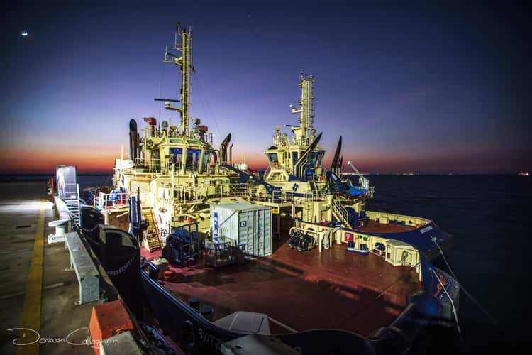 Two tug boats on Stokes Hill wharf sunrise Darwin