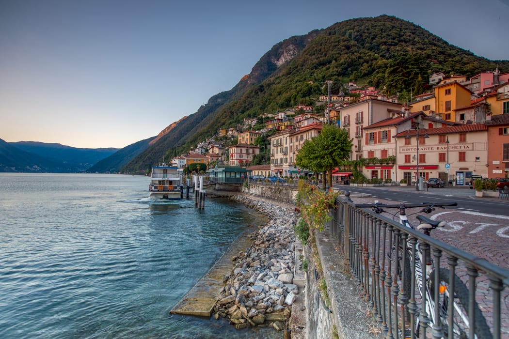 Argegno Ferry leaving the wharf Lake Como, Italy