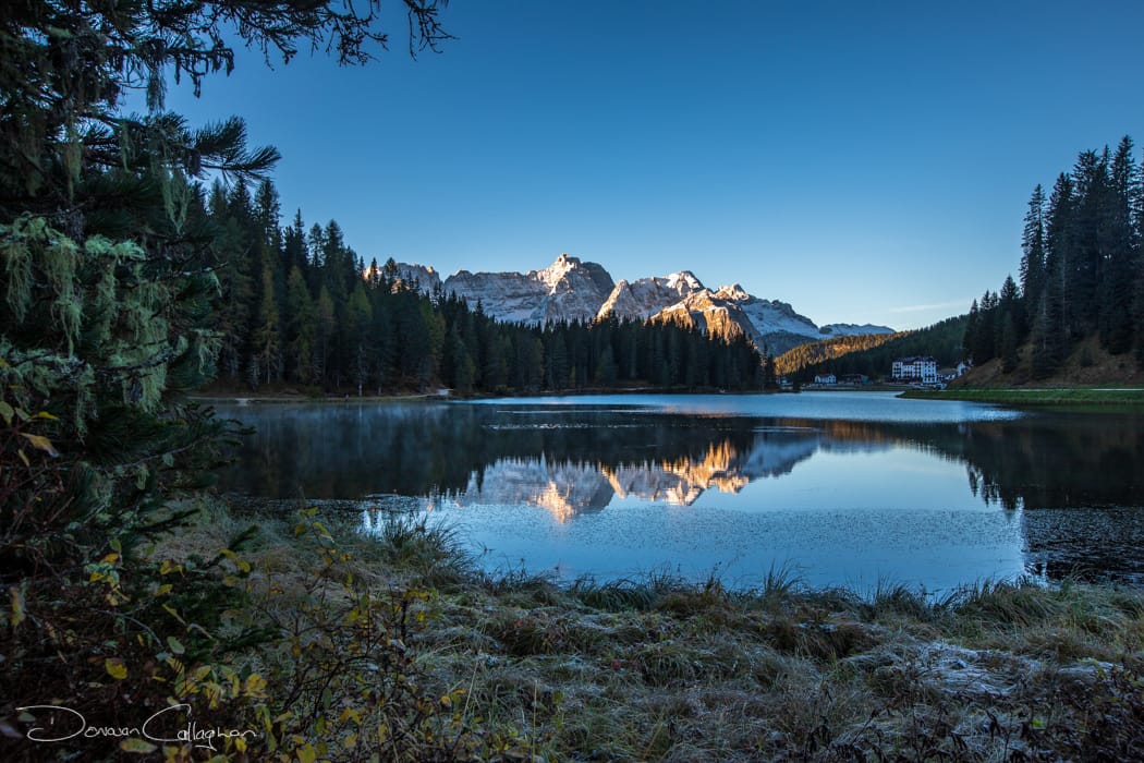Lake Misurina snow covered peaks sunrise Dolomites, Italy