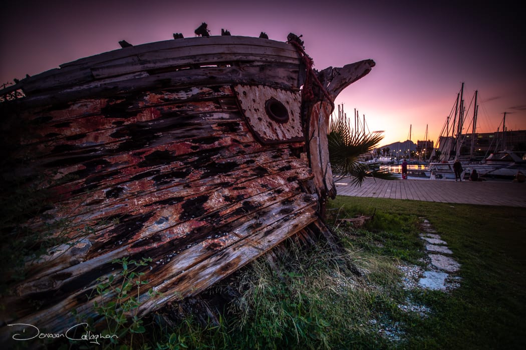 Old boat sunrise Palermo, Italy