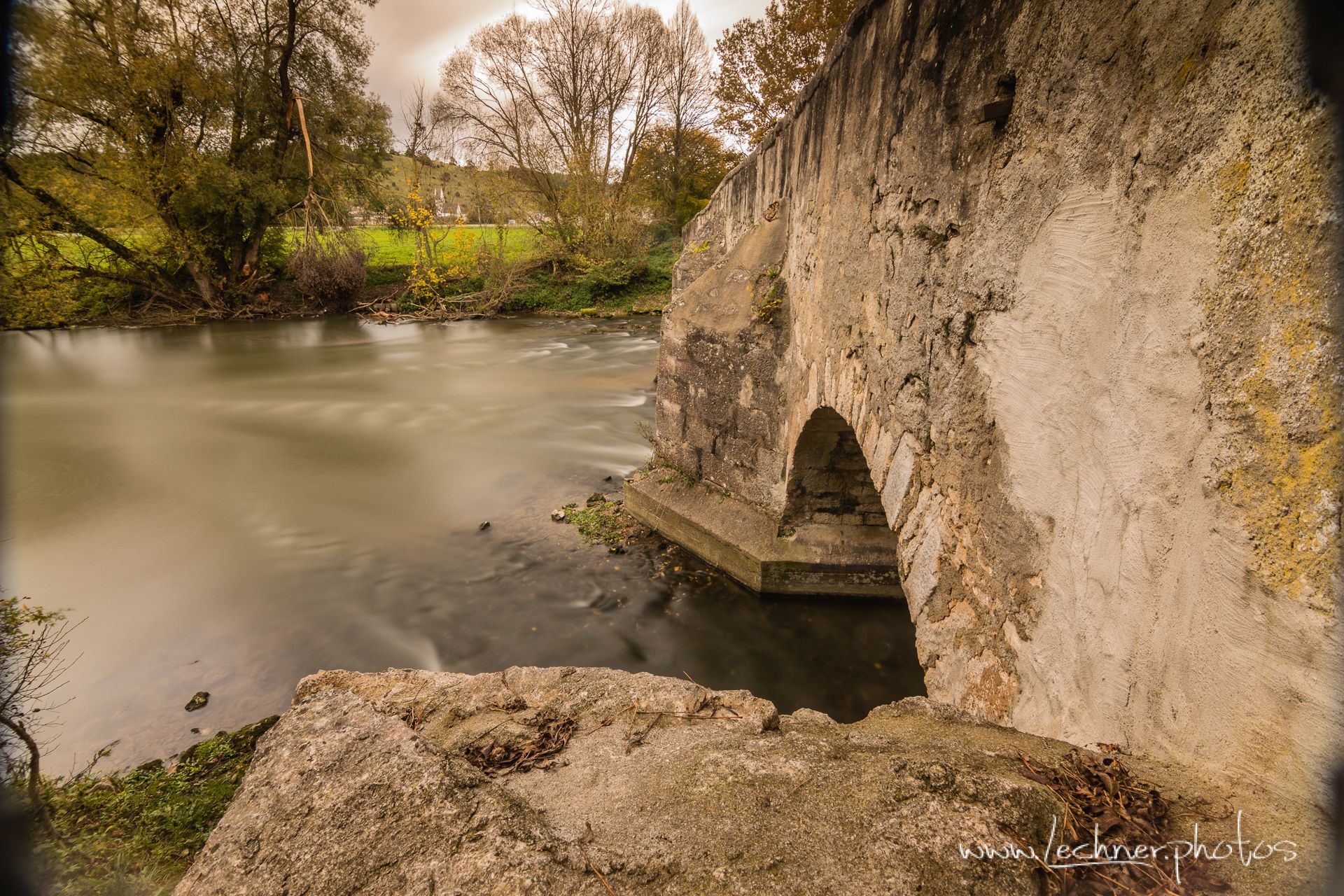 Ancient stone bridge over the Altmuehl River at Pfuenz, Germany