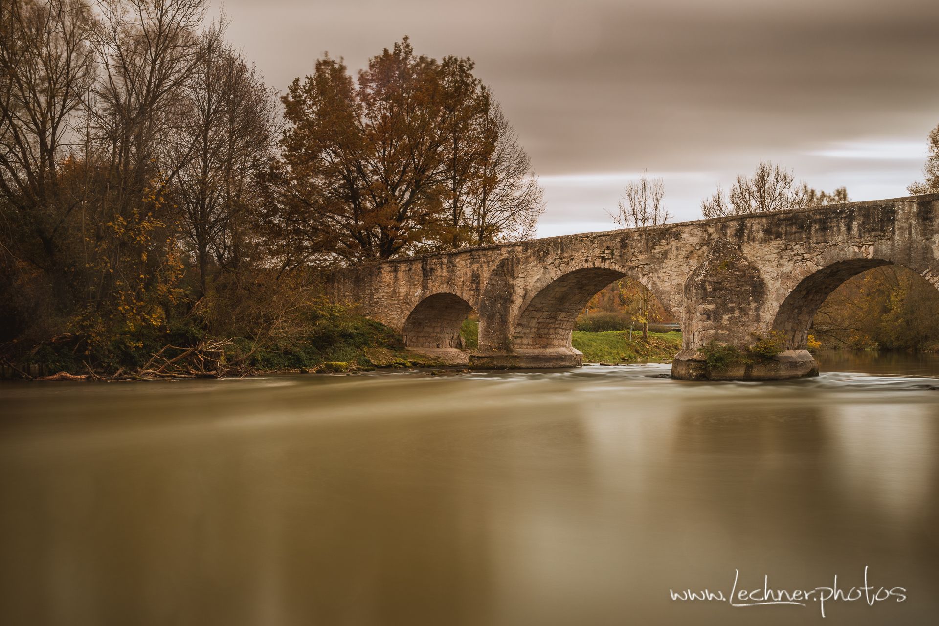 Ancient stone bridge over the Altmuehl River at Pfuenz, Germany