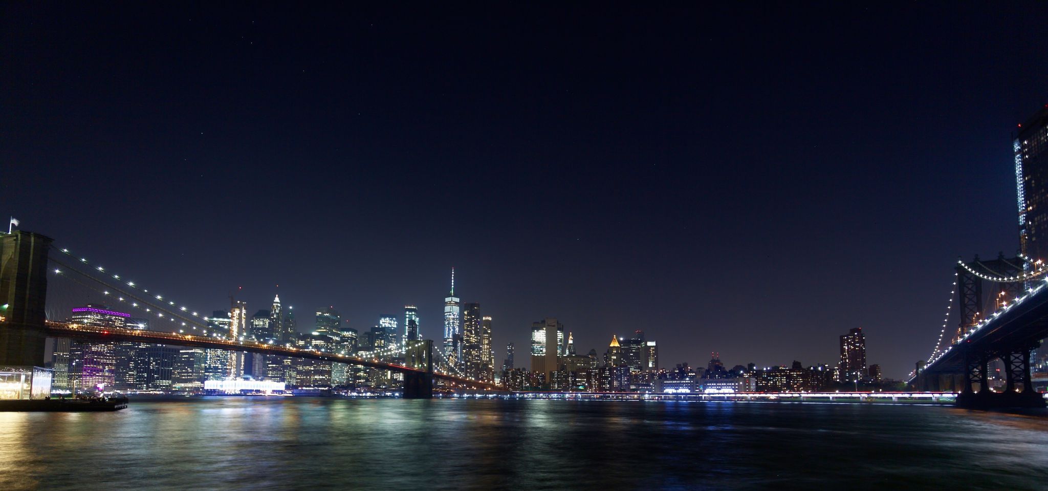 Brooklyn Bridge skyline from Pebble Beach, New York City, USA