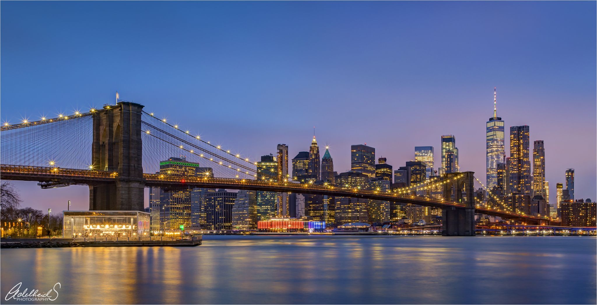 Brooklyn Bridge skyline from Pebble Beach, New York City, USA