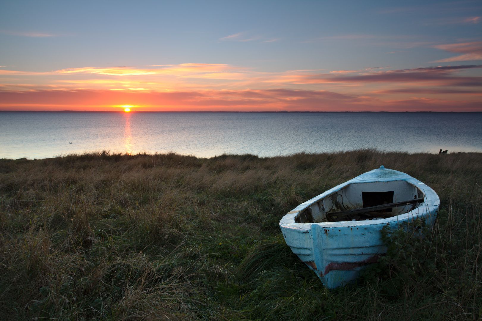 Old boat at the shore close to Ejsingholm, Denmark, Denmark