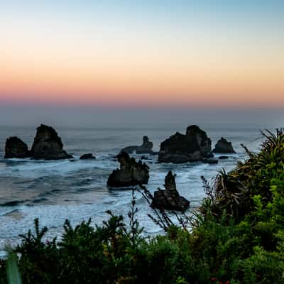 Sea stacks sunrise Barrytown South Island, New Zealand