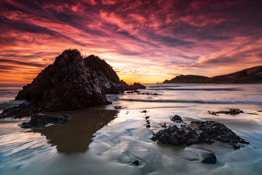 Looking back to Nugget Point at sunrise, New Zealand