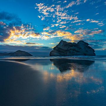 Wharariki Beach sunset Takaka South Island, New Zealand