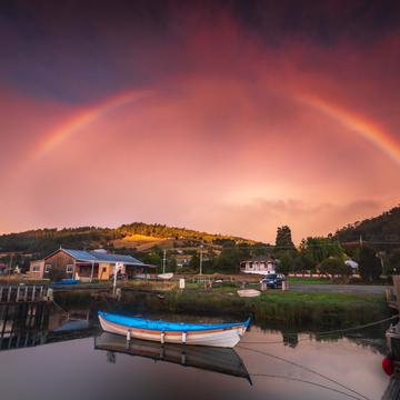 Franklin small boat rainbow sunrise Tasmania, Australia