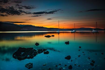 Three sailing boats at sunrise Cygnet Tasmania