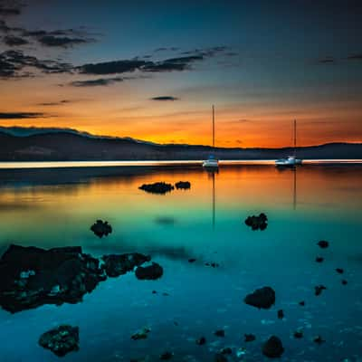 Three sailing boats at sunrise Cygnet Tasmania, Australia