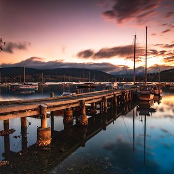 Wharf and sailing boat sunrise Cygnet Tasmania, Australia