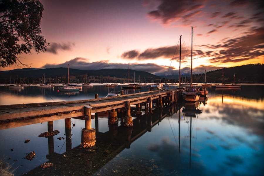 Wharf and sailing boat sunrise Cygnet Tasmania, Australia
