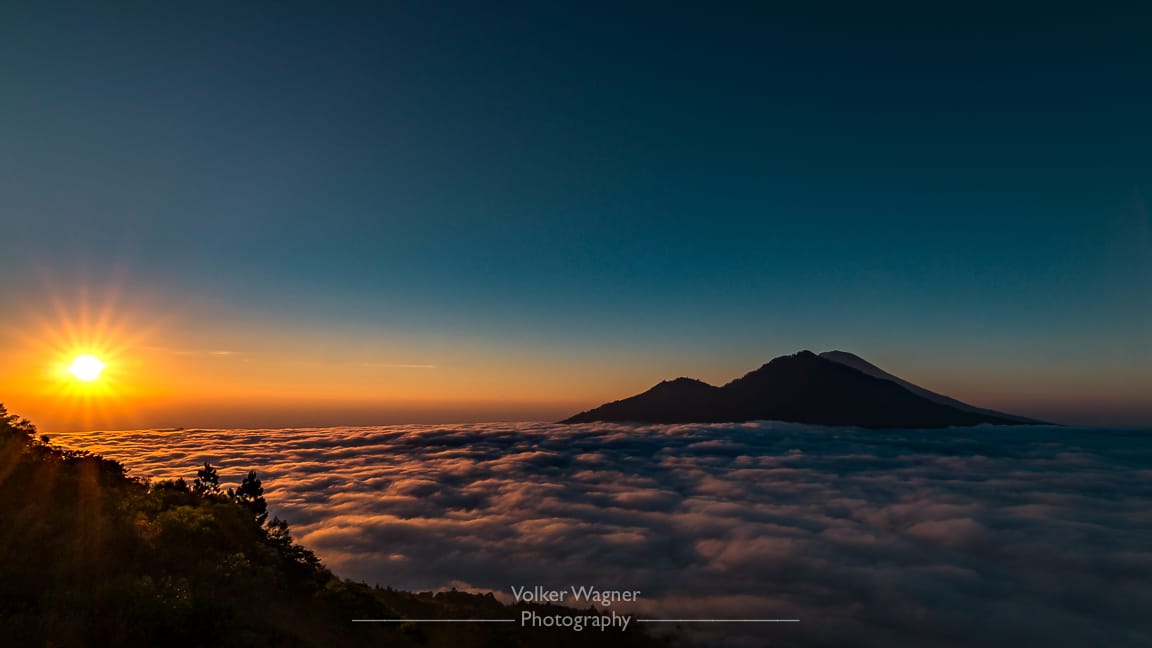 Sunrise above the clouds at Mount Batur, Indonesia