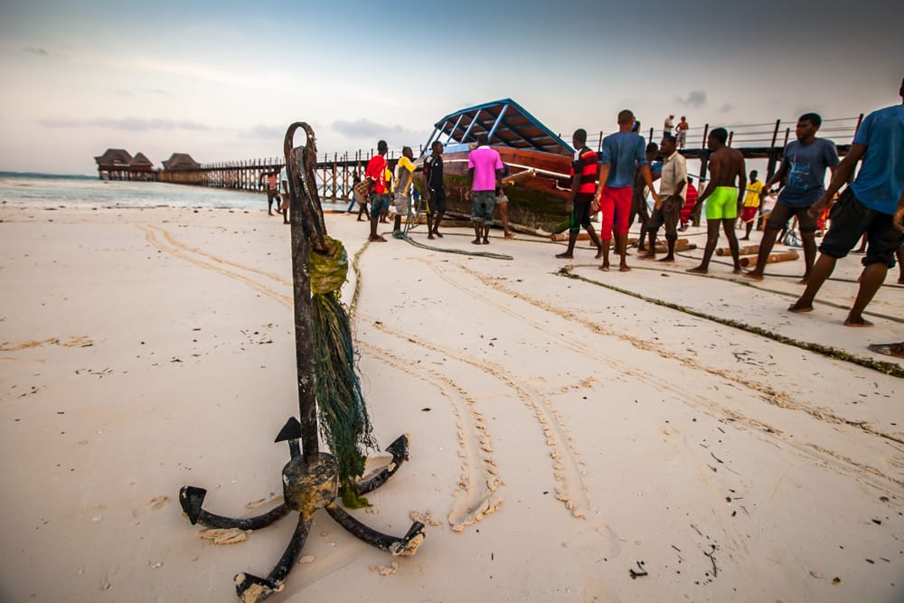 Bringing in the boat Dongwe Zanzibar, Tanzania