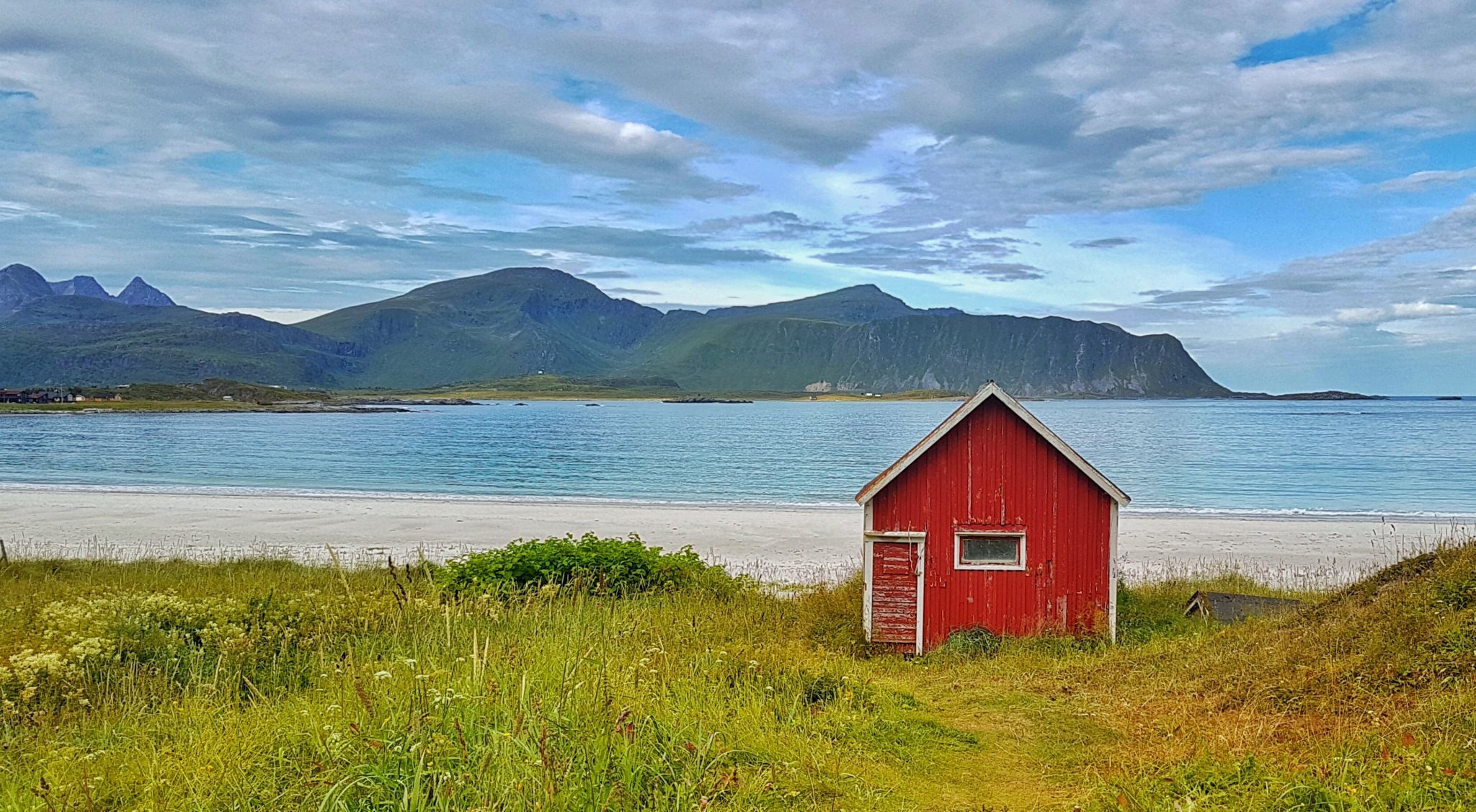 Red hut at Ramberg beach, Lofoten, Norway